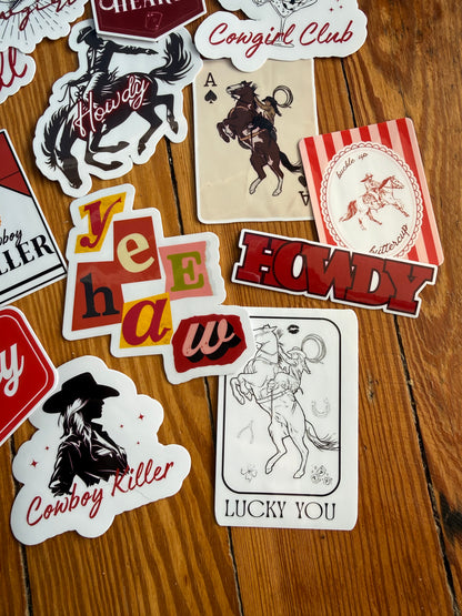 "Lucky You" cherry horseshoe sticker and "Yeehaw" star decal from a chic western sticker set; high-quality glossy finish for outdoor or indoor use.